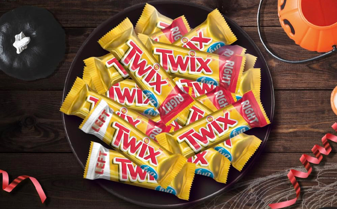 Twix Caramel Chocolate Fun Size Bars in a Bowl on a Wooden Table