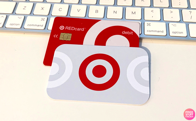 Two Target RedCards on a Table Leaning on a Computer Keyboard
