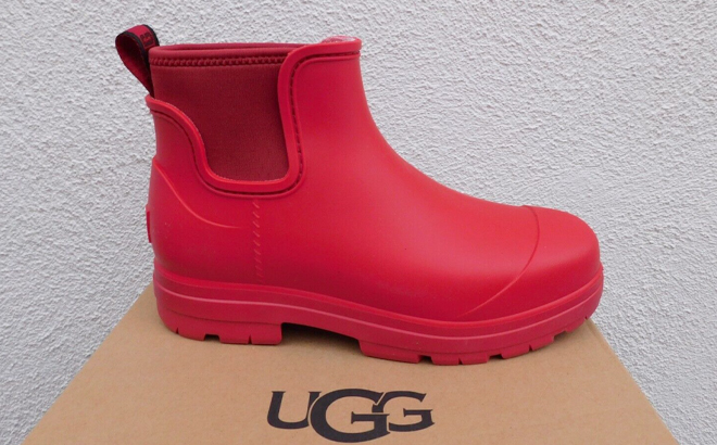UGG Samba Red Droplet Rain Boots on a Shoe Box