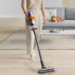Woman Cleaning Hard Wood Floors with the Dyson V15 Detect Cordless Vacuum