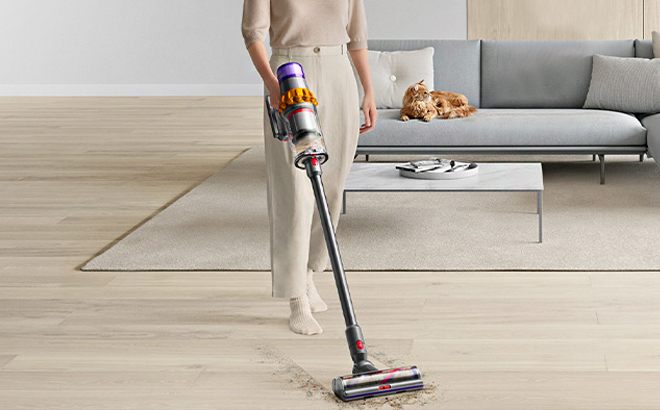 Woman Cleaning Hard Wood Floors with the Dyson V15 Detect Cordless Vacuum