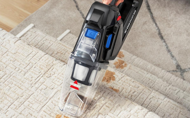 Woman Cleaning the Carpet with the Bissell Pet Stain Eraser Duo Cordless Portable Deep Cleaner & Vacuum
