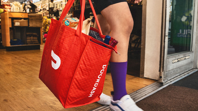 Woman Holding DoorDash Tote Bag with Groceries