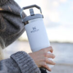 Woman Holding Stanley Ice Flow Flip Straw Tumbler in Polar Color