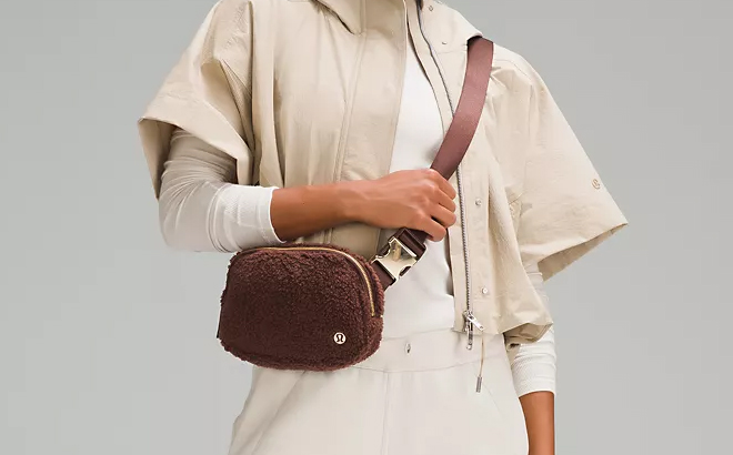 Woman Wearing Lululemon Everywhere Belt Bag in Brown Color