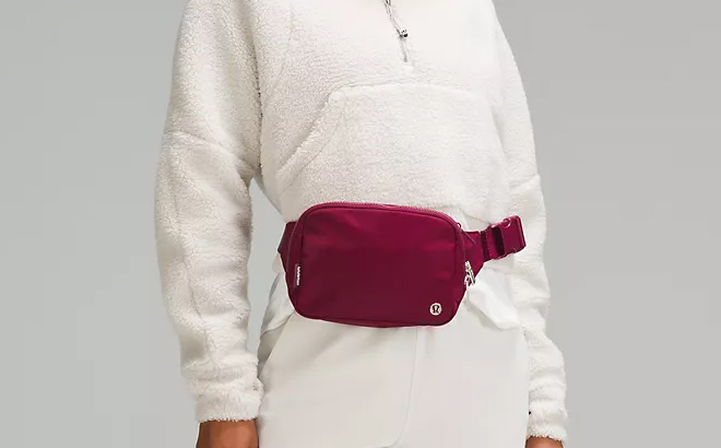 Woman Wearing Lululemon Large Everywhere Belt Bag in Deep Luxe Color