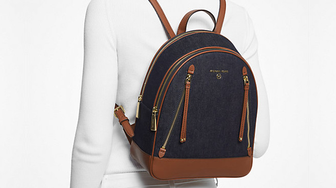 Woman Wearing Michael Kors Brooklyn Medium Denim and Leather Backpack