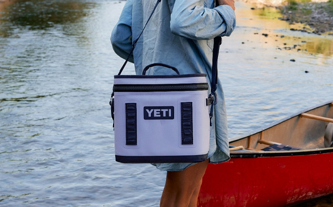 Woman is Carrying YETI Hopper Flip 8 Cooler in Cosmic Lilac Color