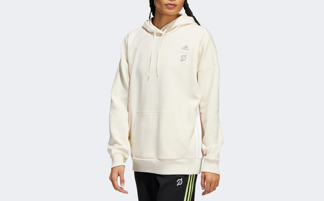Woman is Wearing Adidas Womens Capable Of Greatness Hoodie in Wonder White Color