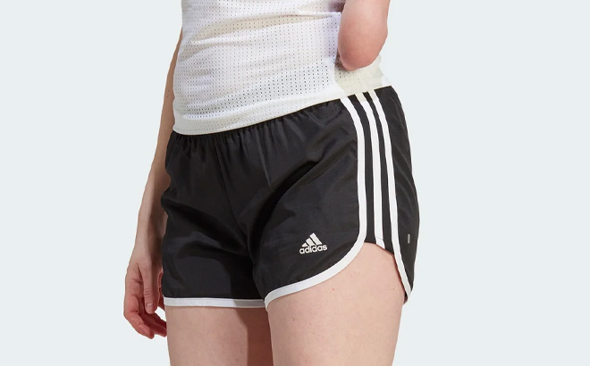 Woman is Wearing Adidas Womens Marathon 20 Shorts in Black and White Color