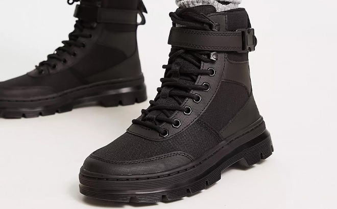 Woman is Wearing Dr Martens Combs Tech Leather Boots in Black Color