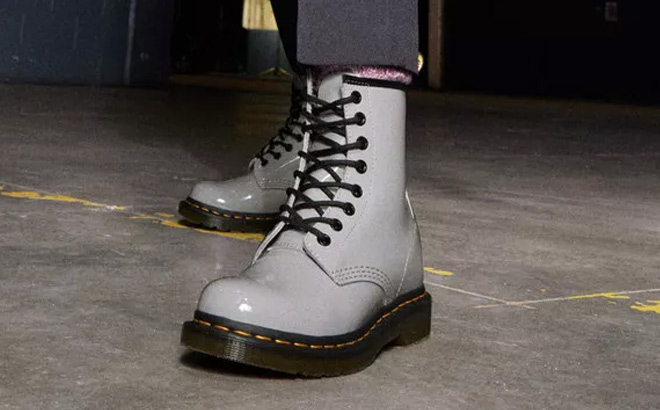 Woman is Wearing Dr Martens Leather Combat Boots in Gray Color