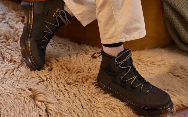 Woman is Wearing Dr Martens Leather Platform Boot in Black Boury Color