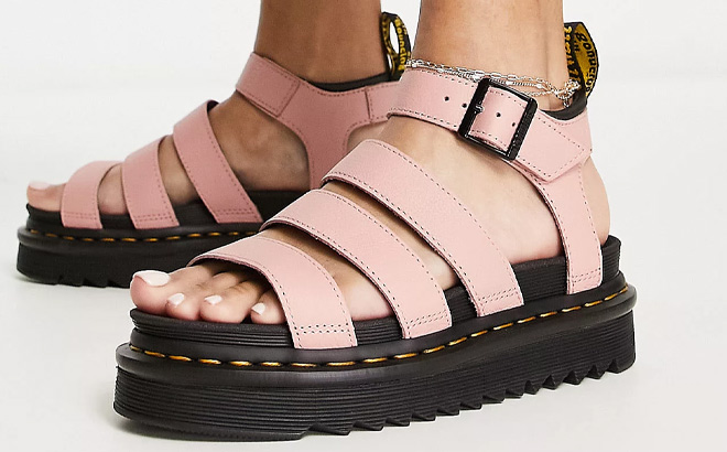 Woman is Wearing DrMartens Blaire Three Strap Sandals in Beige Color Closer View