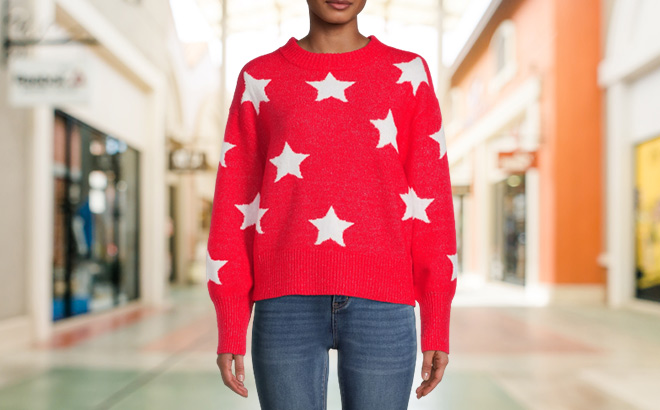 Woman is Wearing Heart N Crush Womens All Over Stars Pullover Sweater in Red Color with White Stars