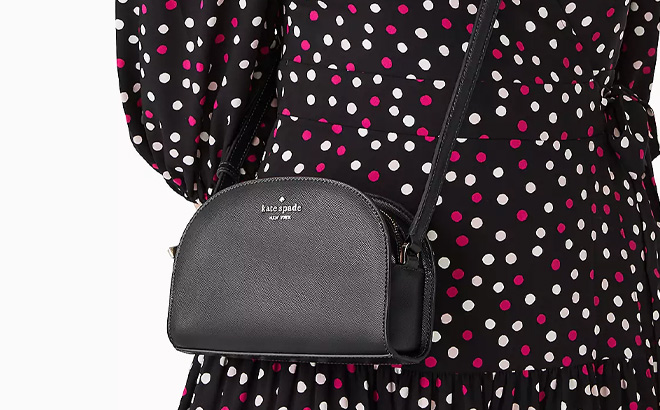 Woman is Wearing Kate Spade Perry Leather Dome Crossbody in Black Color