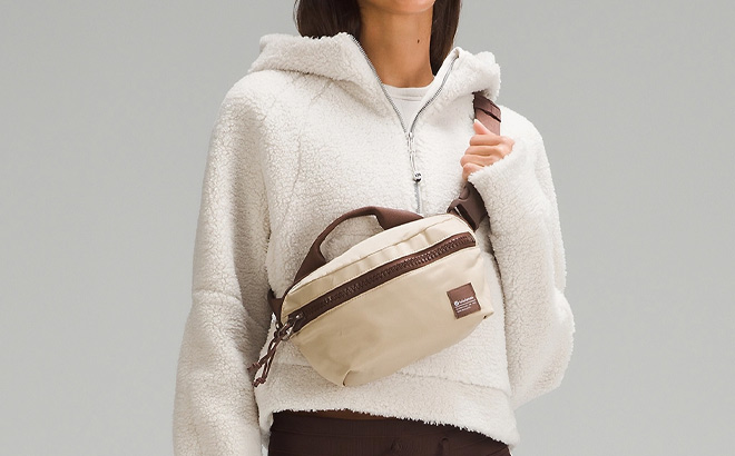 Woman is Wearing Lululemon All Day Essentials Belt Bag in Brown Earth Color