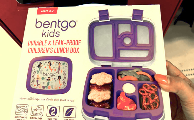 a Hand Holding Bentgo Lunch Box in front of Target Price Checker Machine