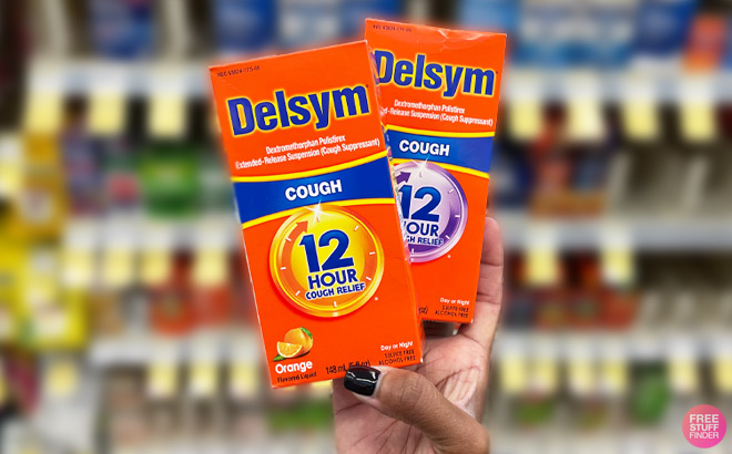a Hand Holding Delsym Cough Products