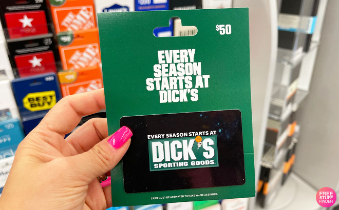 a Hand Holding Dicks Sporting Goods Gift Card