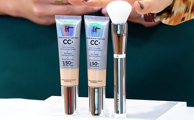 a Hand Hovering over IT Cosmetics 3 Piece Set a Hand Hovering over IT Cosmetics 3 Piece Set