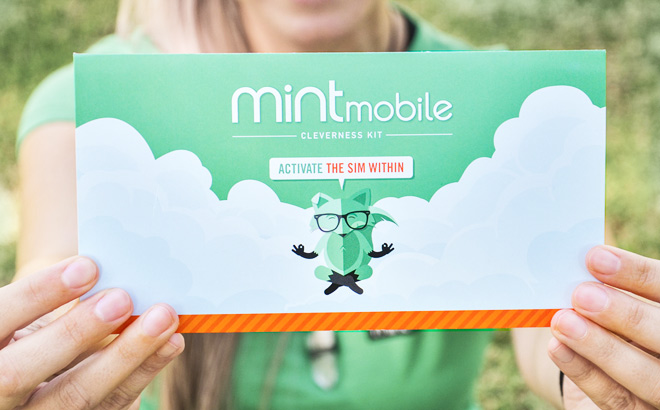 a Woman Holding Mint Mobile SIM Kit