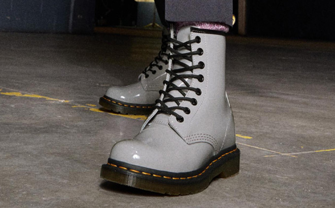 a Woman Wearing Dr Martens 1460 Boots in Gray Color