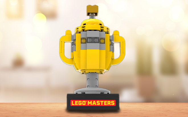 an Image of LEGO Masters Mini Trophy Set on a Wooden Table