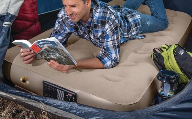 an Image of a Man Lying in a Coleman Twin Air Mattress