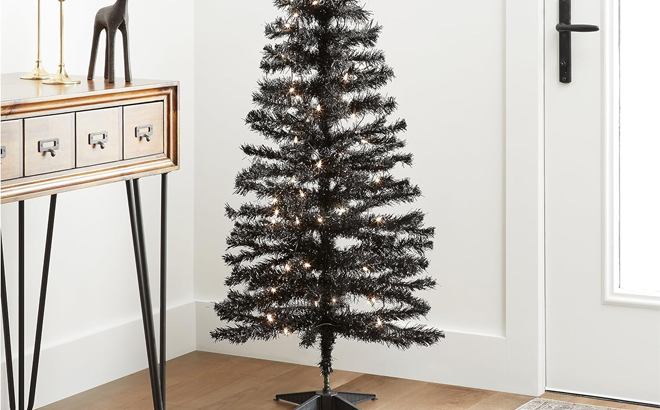 4 Foot Pre Lit Artificial Christmas Tree Black Tinsel White Lights Includes Stand