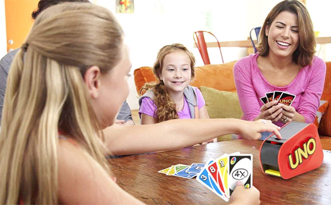 A Family Playing UNO Attack Card Game with Card Launcher