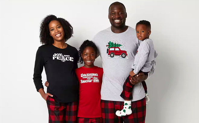 A Family Wearing Checks & Trucks Buffalo Matching Family Pajamas