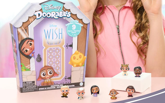 A Girl Playing Disney Doorables NEW Wish Collector Peek