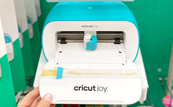 A Hand Holding a Cricut Joy Machine A Hand Holding a Cricut Joy Machine