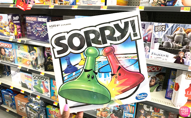 A Hand Holding a Sorry Kids Board Game on Walmart Toy Aisle