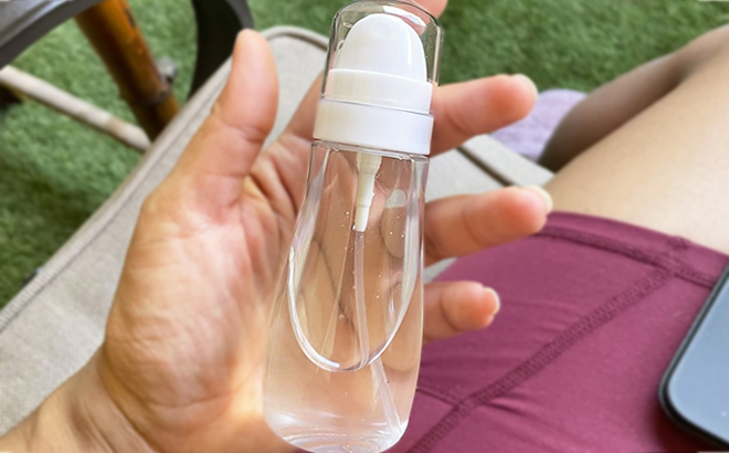 A Hand Holding a Spray Mist Bottle