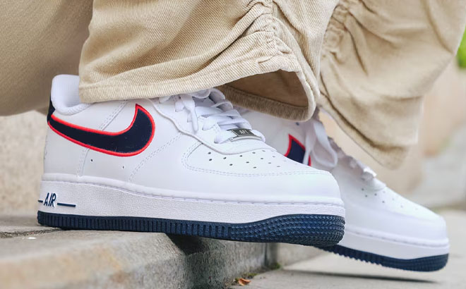 A Person Wearing a Nike Womens Air Force 1 07 Shoes
