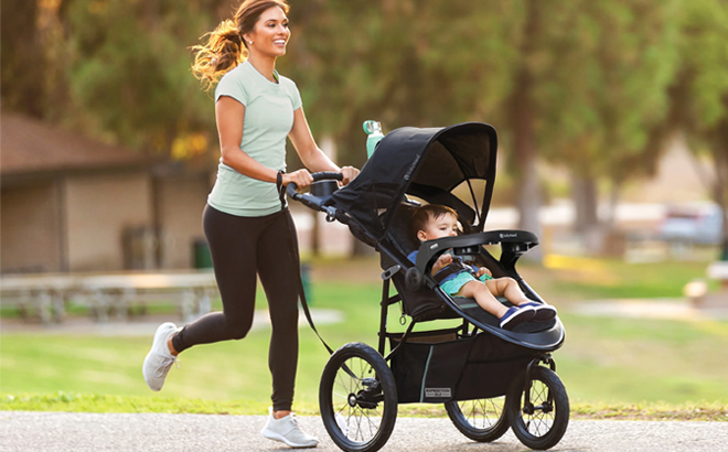 A Running Woman with a Baby Sitting in Baby Trend Expedition DLX Jogger Travel System