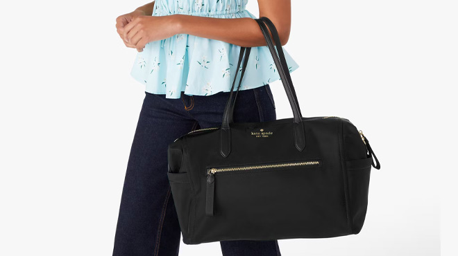 A Woman Holding Kate Spade Chelsea Nylon Weekender A Woman Holding Kate Spade Chelsea Nylon Weekender