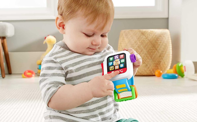 Baby Playing with Fisher Price Laugh Learn Smartwatch