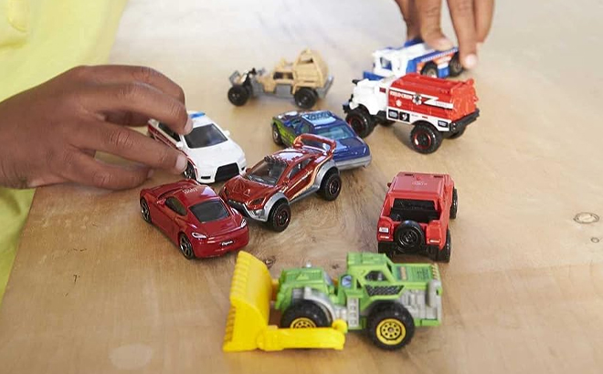 Boy Playing with his set of Matchbox Toy Cars