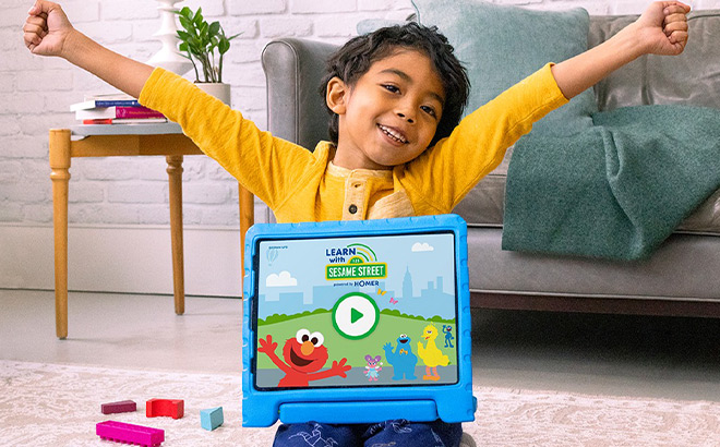 Boy with a Tablet on his Lap with Homer Learning Program on It