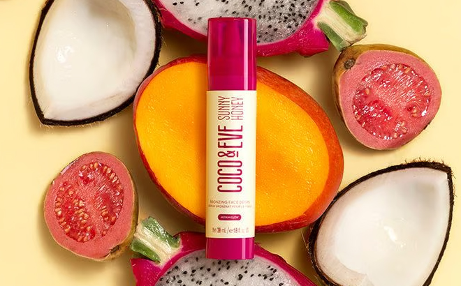 Coco Eve Bronzing Face Drops on top of a fruit
