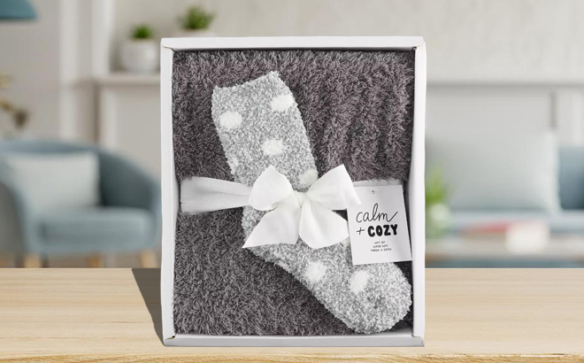 Cozy Socks and Throw Blanket Gift Set in Original Packaging on a Tabletop