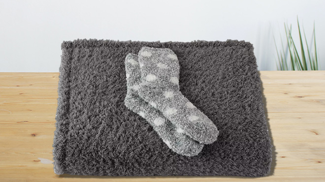 Cozy Socks and a Throw Blanket on a Tabletop