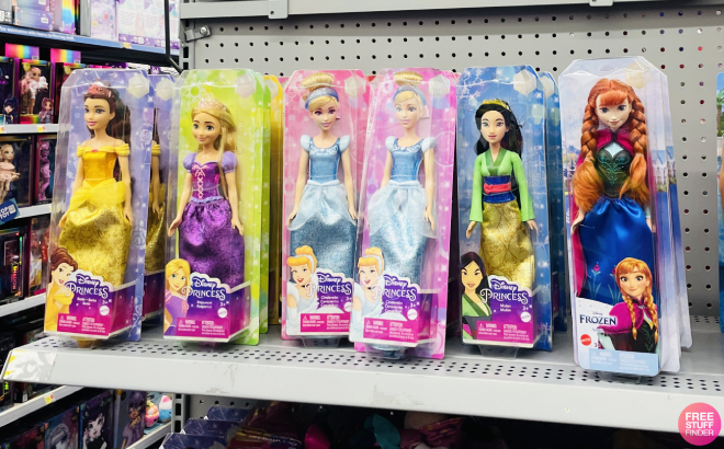 Six Boxes of Disney Princess Fashion Dolls on a Shelf at a Store