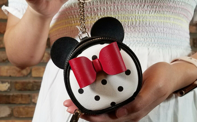 A Person Holding a Kate Spade Disney Minnie Mouse Coin Purse