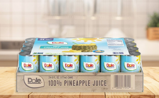 Dole 100 Pineapple Juice 24 Pack on a Table