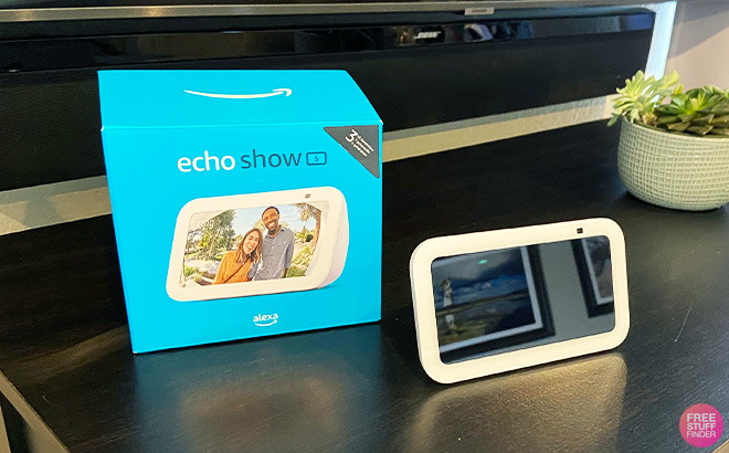 Echo Show 5 next to a Box on a Tabletop