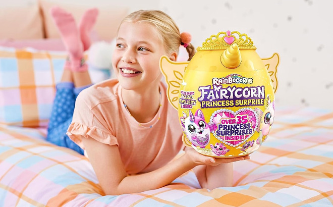 Girl is Holding Rainbocorn Fairycorn Princess by ZURU